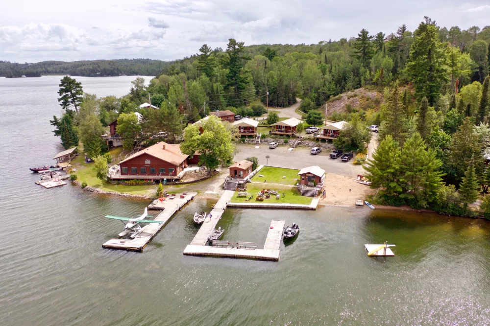 Enjoy Lakeside Camping with Fishing Boats for the Ultimate Outdoor Adventure