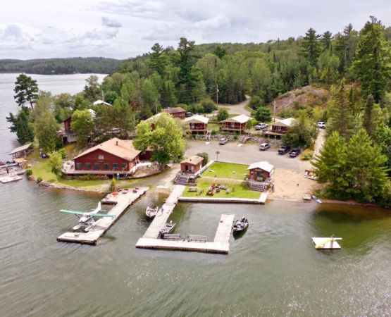 Enjoy Lakeside Camping with Fishing Boats for the Ultimate Outdoor Adventure